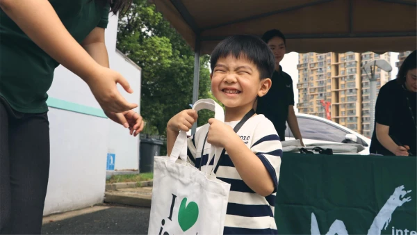 smiling happy male student worth the International School of Wuxi cost