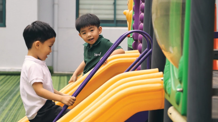 two young male students inside international school of wuxi learning at the early childhood center